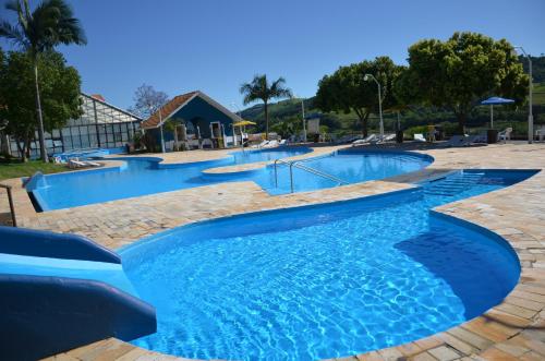 a large pool with blue water in a resort at Paraiso das Aguas in Marcelino Ramos
