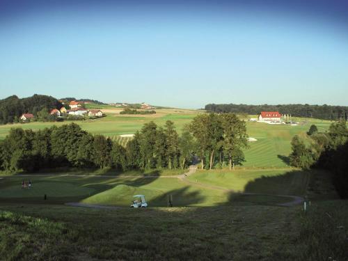 a view of a golf course with a green at Gästehaus - Camping- Weinhof Radl in Klöch
