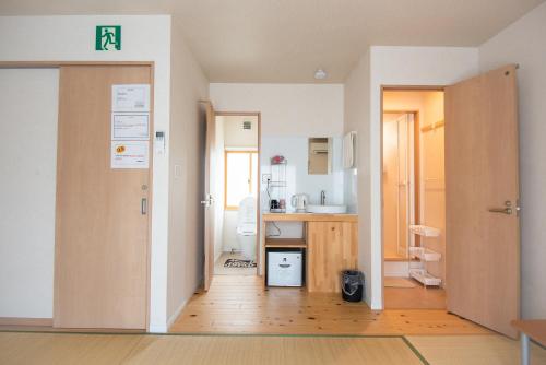 Баня в Osaka Guesthouse SAYURI TENGACHAYA Ekimae