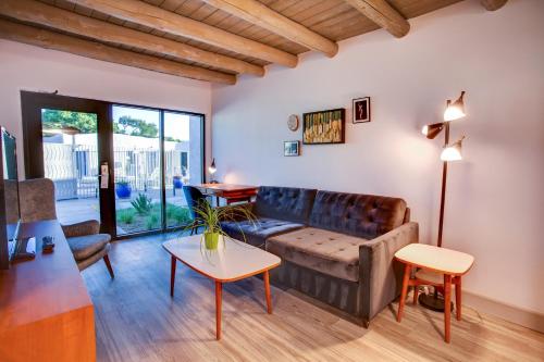 a living room with a couch and a table at El Vado Motel in Albuquerque