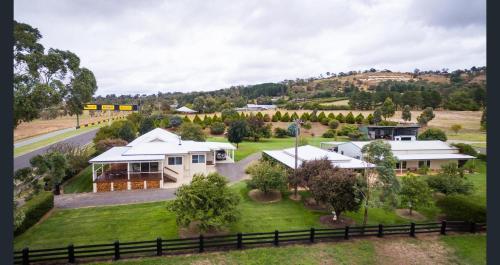 an aerial view of a house with a yard at 505a CONROD STRAIGHT MOUNT PANORAMA in Bathurst