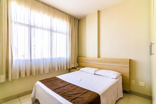 Cama o camas de una habitación en Villa Neves Residence
