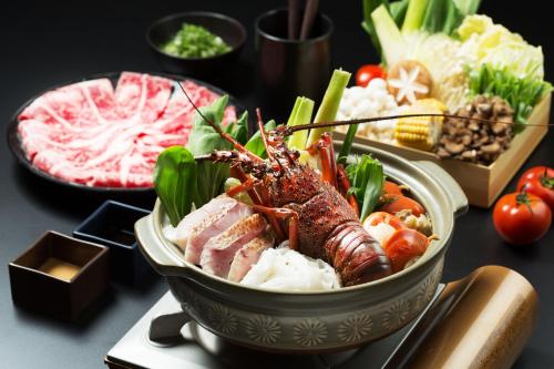 a bowl of food with meat and vegetables on a table at 礁溪晶泉丰旅 Wellspring by Silks Jiaoxi in Jiaoxi