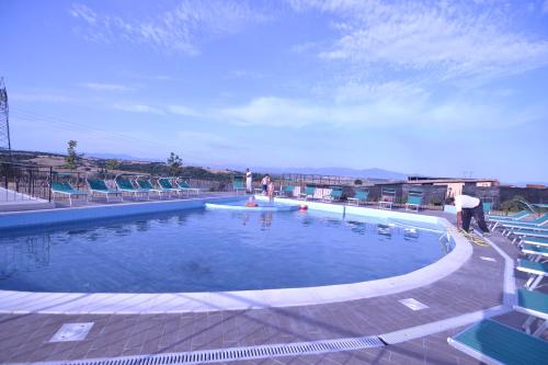 a man riding a skateboard in a swimming pool at Il Casale Di Roma in Prima Porta