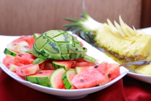 a bowl of fruit with a turtle on top of it at Galaxy Grand Hotel in Nuwara Eliya