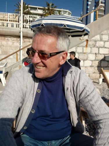 a man wearing sunglasses sitting on a boat at Bed and Breakfast Miotto in Montegalda