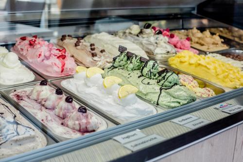a display case filled with lots of different types of desserts at Hotel Bolte in Salzbergen
