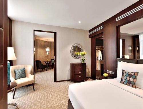 Voodi või voodid majutusasutuse Radisson Blu Atria Bengaluru toas