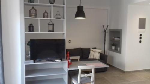 a living room with a couch and a table at Milva Apartments in Kos Town