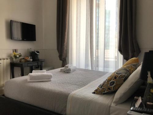 Letto o letti in una camera di Vatican City Holidays Guesthouse