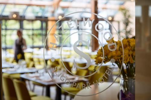 a restaurant with a table with a sign that says happy birthday at Sligo Park Hotel & Leisure Club in Sligo
