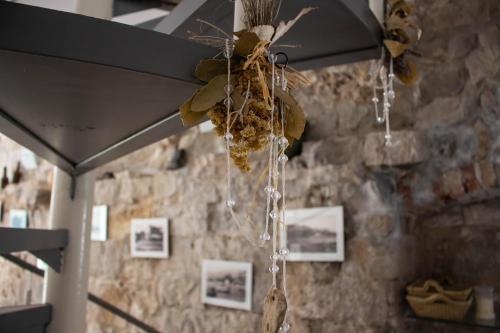 a bunch of food hanging from a ceiling at Villa Cindro House in Podstrana