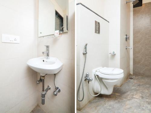 a bathroom with a sink and a toilet at Hotel Amar International in New Delhi