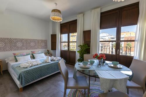 Posteľ alebo postele v izbe v ubytovaní Apartamentos El Marqués
