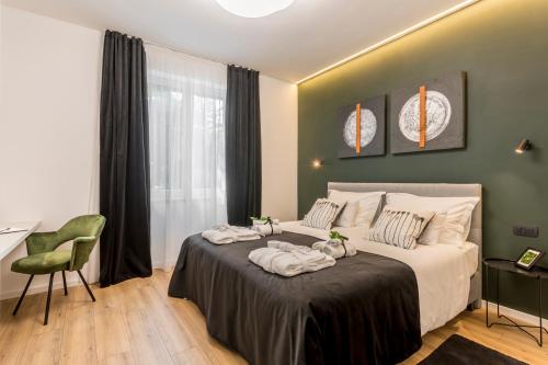 Lova arba lovos apgyvendinimo įstaigoje Monvi Luxury Suites