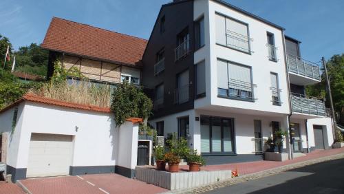 a white and black building on a street at Haus Sonnenschein in Witten