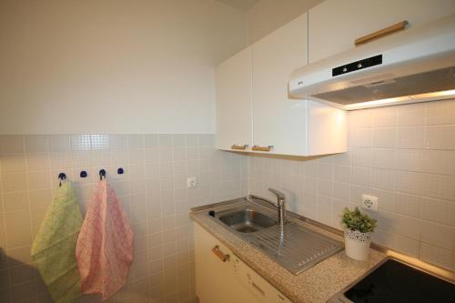 a kitchen with a sink and a counter top at Alpenflair Ferienwohnung Whg 108 in Oberstdorf