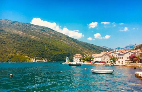 a view of a lake with boats in the water at Oldhouse Vucinovic in Tivat
