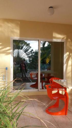 a person taking a picture of a table and chairs at Marisa Residences in La Gaulette
