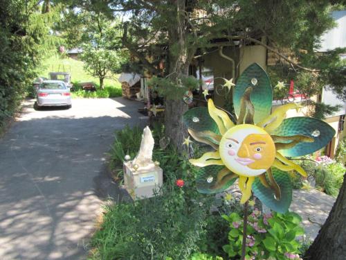 a sun decoration on the side of a house at Arve in Bitsch