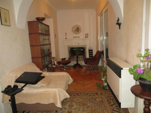 a living room with a couch and a table at Guest House Kamea in Sighnaghi