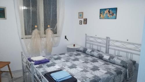Un pat sau paturi într-o cameră la Le Querce Santa Cesarea Terme