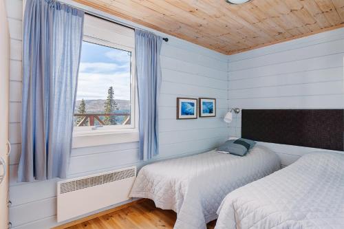 Un pat sau paturi într-o cameră la Villa Falken