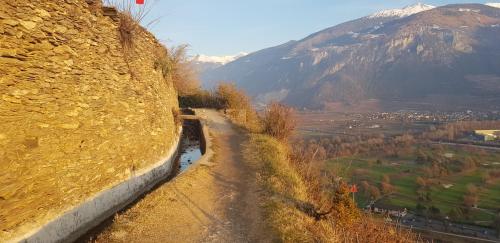 a dirt road on the side of a mountain at Le Merle Châtelain in Sion