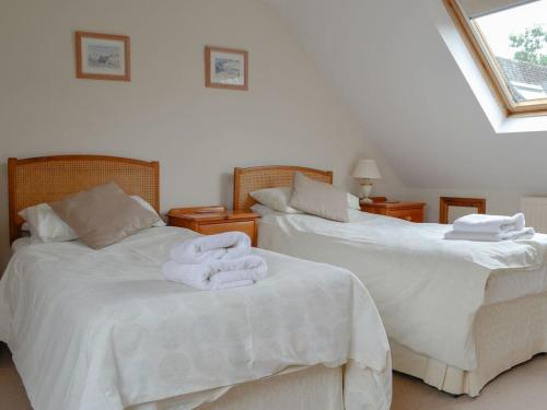 A bed or beds in a room at The Burrows 