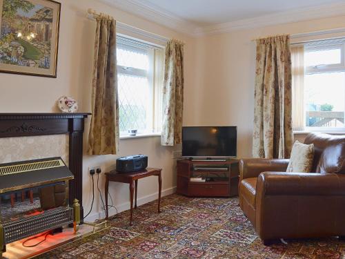 A television and/or entertainment center at Benjay Cottage 