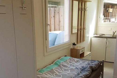 a bedroom with a mirror and a bed in a room at Monteurzimmer Glückstadt in Glückstadt