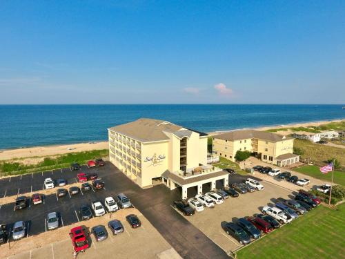 an aerial view of a hotel with a parking lot at Surf Side Hotel in Nags Head