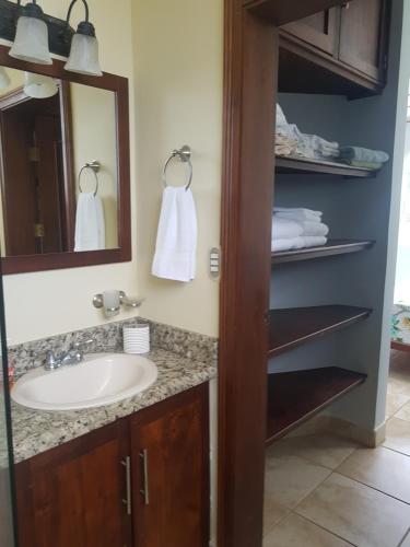 a bathroom with a sink and a mirror at Casa Malia Guapinol #8 in Tamarindo