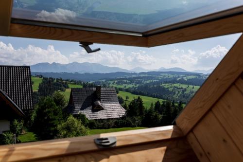 a view from a window of a house in the mountains at Miętowa Górka in Ząb