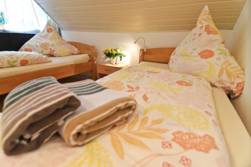 a bedroom with two beds with towels on them at Top Apartmentwohnungen Veltins Arena in Gelsenkirchen