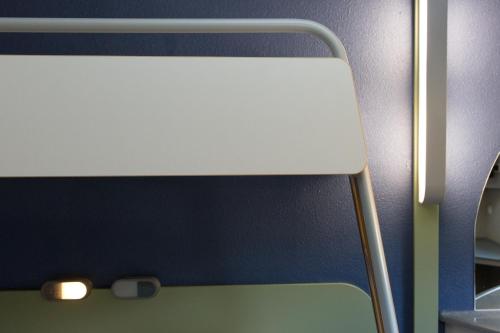 a close up of a headboard of a bed at Ibis Budget Sisteron in Sisteron