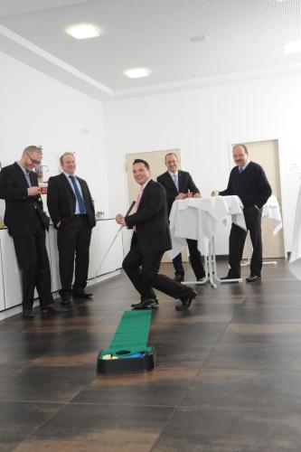 a group of men in suits standing around a table at Best Western Hotel Würzburg-Süd in Würzburg