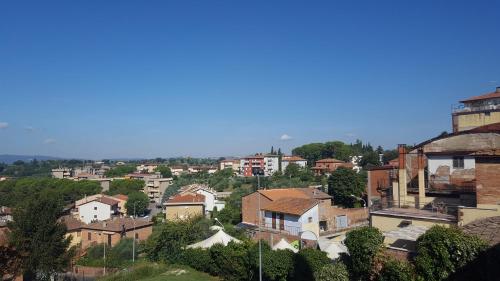 a view of a city with buildings and trees at Tuscany Experience BnB in Foiano della Chiana