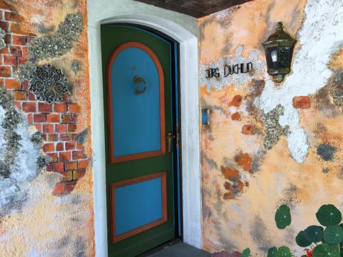 a door to a building with a brick wall at Casa toscana in Thun
