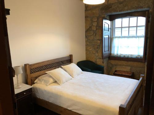 En eller flere senge i et værelse på Quinta da Portela - Casa Visconde Arneiros