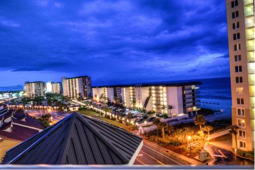 a view of a city at night with buildings at Grand Panama Resort 2-202 By Aneliya in Panama City Beach