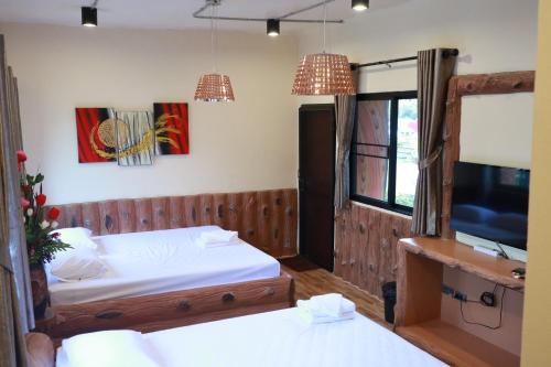 Ένα ή περισσότερα κρεβάτια σε δωμάτιο στο Angie Resort at Nakhon Nayok