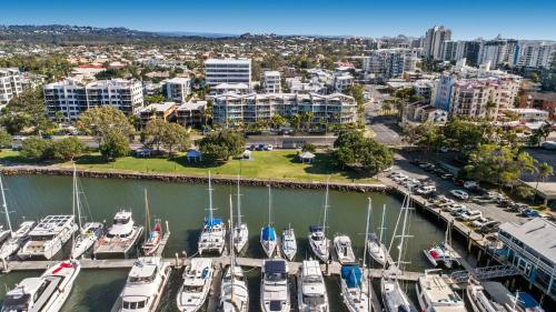 an aerial view of a marina with boats docked at Sailport Mooloolaba Apartments in Mooloolaba