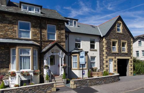 a house in the middle of a street at Thornbank House Offering Breakfast and with the use of Free Local Health Club in Windermere