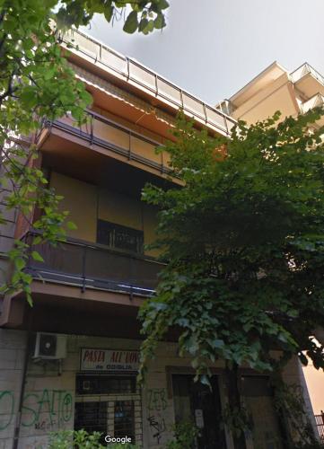 a building with graffiti on the side of it at Luxury Penthouse with Sea View - City Center in Pescara