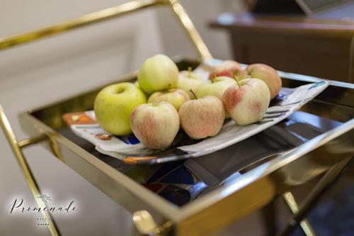 a tray of apples on top of a table at Villa Promenade in Burgas City