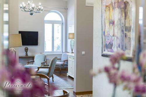 a living room and dining room with a dining table at Villa Promenade in Burgas City