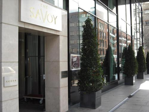 a building with a christmas tree in front of it at The Savoy Hotel in Limerick