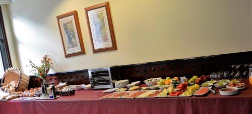 a buffet of fruits and vegetables on a table at Hotel Loiola in Azpeitia