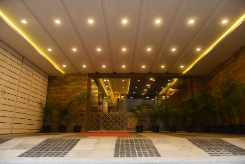 a lobby of a building with lights on the ceiling at The Hydel Park - Business Class Hotel - Near Central Railway Station in Chennai